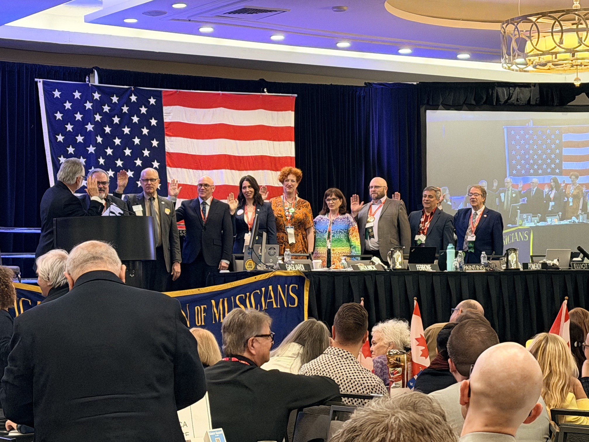 AFM officers taking the oath of office on stage